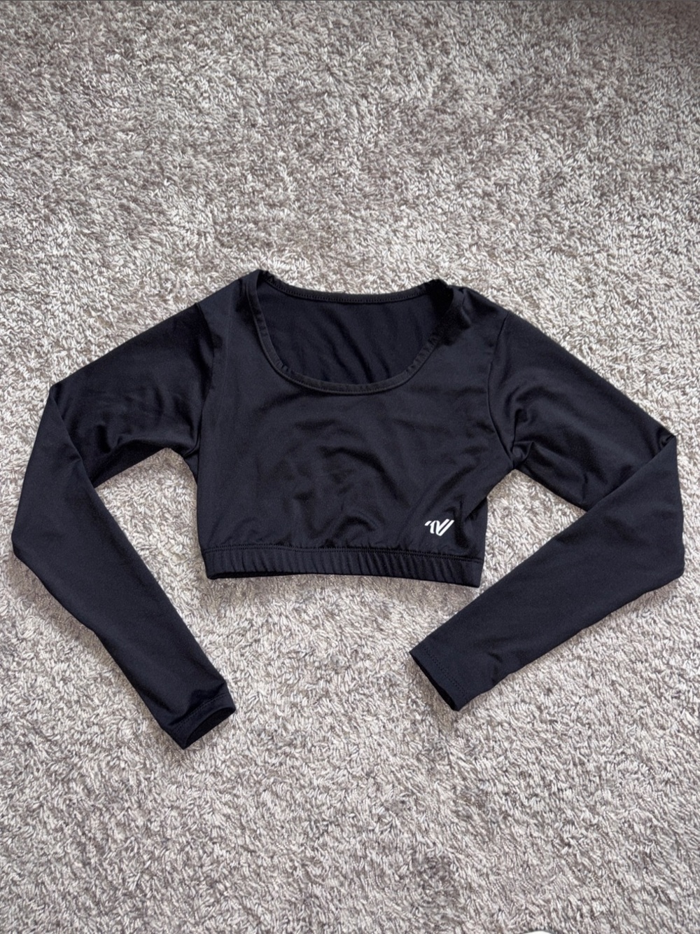 Varsity Black Long-Sleeve Cropped Athletic Top. Scoop neck liner. SSMSC15